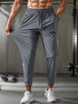 Men's Waist Drawstring Quick-drying High Elasticity Solid Color Sports  Long Pants With Zipper Pockets